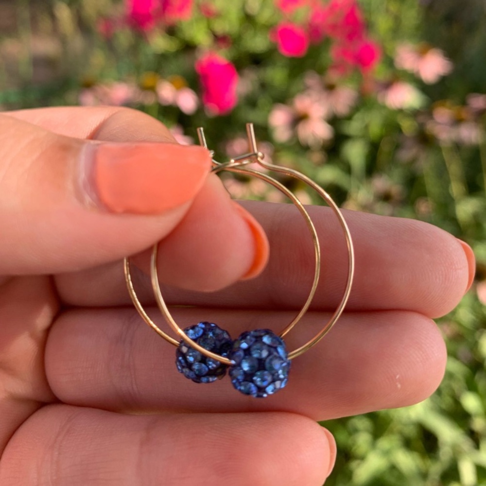 NWOT gold hoop wire earrings with blue sparkle bead.